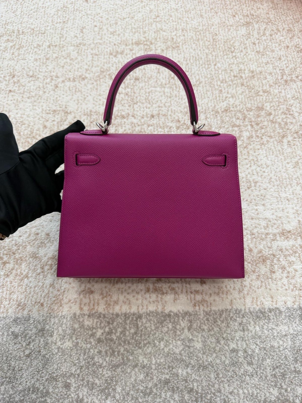 Violet single-handle bag with precise trapezoidal edges, rear view